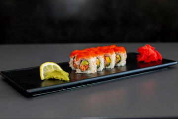 japanese sushi food. Maki ands rolls with tuna, salmon, shrimp, crab and avocado. Top view of assorted sushi. Rainbow sushi roll, uramaki, hosomaki and nigiri. Assorted sushi