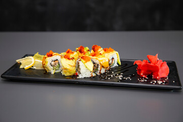 japanese sushi food. Maki ands rolls with tuna, salmon, shrimp, crab and avocado. Top view of assorted sushi. Rainbow sushi roll, uramaki, hosomaki and nigiri. Assorted sushi