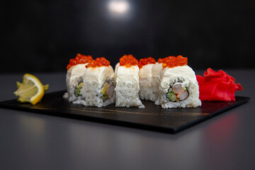 japanese sushi food. Maki ands rolls with tuna, salmon, shrimp, crab and avocado. Top view of assorted sushi. Rainbow sushi roll, uramaki, hosomaki and nigiri. Assorted sushi
