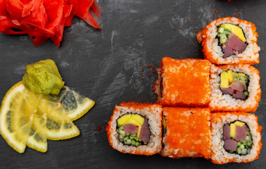 japanese sushi food. Maki ands rolls with tuna, salmon, shrimp, crab and avocado. Top view of assorted sushi. Rainbow sushi roll, uramaki, hosomaki and nigiri. Assorted sushi
