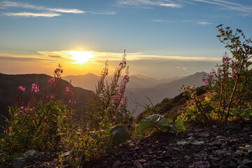 Sunset in the mountains. Beautiful mountain landscape, different terrain,