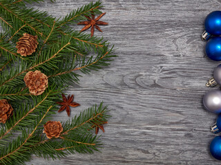 New year's background.Pine branches and Christmas decorations lie on a wooden background.Space for text.