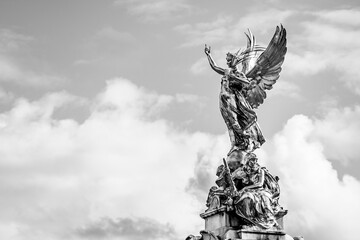 Victory Goddess golden statue on top of the Victoria Memorial located in front of Buckingham Palace...