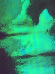 reflection iridescent holographic background pattern texture mermaid/unicorn fantasy background concept Holographic surface wrinkled foil pastel. Real Hologram Background of wrinkled abstract stock