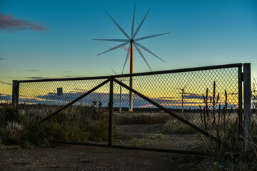 road with closed gates to wind generators