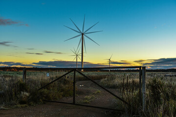 road with closed gates to wind generators