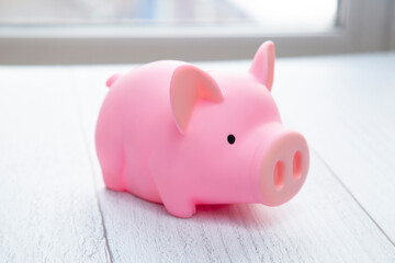 Pink piggy Bank on white background. The concept of saving money.