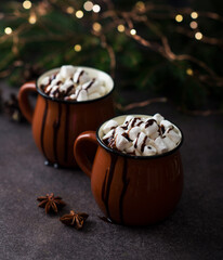 Obraz na płótnie Canvas Christmas cocoa with marshmallows in a mug, new year's drink