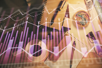 Double exposure of forex graph drawing and work table top veiw. Concept of financial analysis.