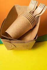 Eco friendly bioorganic starch tableware Zero waste disposable fast food containers made from recycled materials craft cutlery Plastic free food background rustic