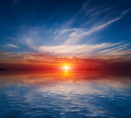 Fototapeta na wymiar sunset scene over lake water