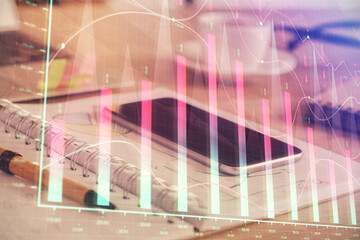 Double exposure of forex chart drawing and cell phone background. Concept of financial data analysis