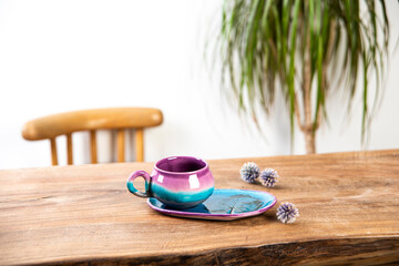 handmade ceramic coffee cup on wooden table