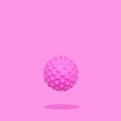 Spiny ball or corona virus trendy conceptual photo on pink background