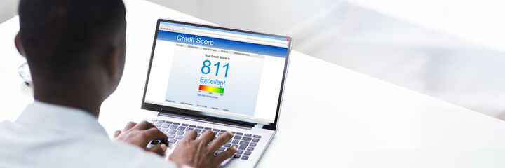 Close-up Of A Businessman Checking Credit Score Online