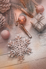 Fototapeta na wymiar Christmas background with toys, balls, cinnamon, sprigs of Christmas tree and sled. Place for text 