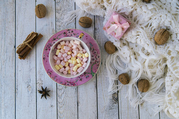 A lot of marshmallow, sweater, cinnamon, presents . Cozy christmas composition.Winter time. Christmas holiday concept.