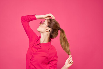 Fototapeta premium Woman in pink shirt and brown glasses cropped view fashion model emotions gesturing hands portrait