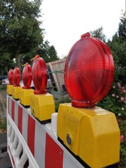 Fototapeta na wymiar traffic warning lights on road