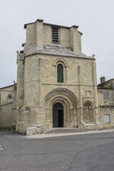 Fototapeta na wymiar XII century Romanesque style Eglise Collegiale on St Emilion’s Place Pierre Meyrat. SAINT-EMILION, BORDEAUX, FRANCE. April 14, 2019.