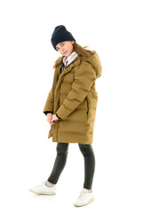Naklejka na ściany i meble Beautiful little girl in a fashionable coat.