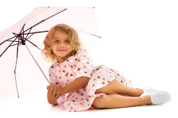 Little girl under an umbrella.Concept style and fashion. Isolated on white background.