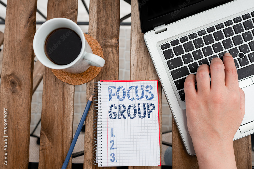 Poster conceptual hand writing showing focus group. concept meaning showing assembled to participate in dis