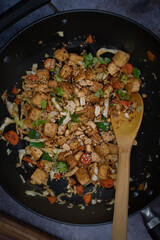 Vegan tofu, cabbage and peper stirfry in wok