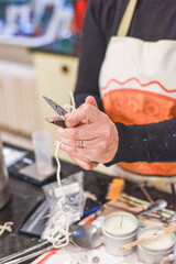 Preparing and trimming the wick of a home made scented aromatherapy candle