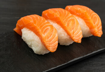 Slices of Raw Salmon Fillet on Black Background Mockup Top View