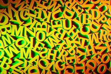 School and learning theme. Yellow Latin letters on a green background. English letters in random order. Pattern of letters. The concept of literacy.