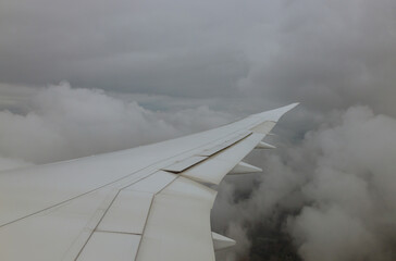 Fototapeta na wymiar Sky with white cloudy that from airplane clouds plane wing