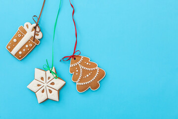 Different delicious Christmas cookies on light blue background, flat lay. Space for text