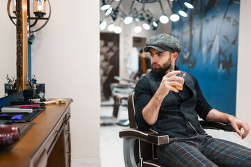 Barber master with a glass of whiskey