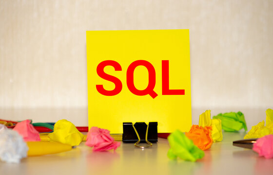 The SQL label on the yellow business card from the daily planner.