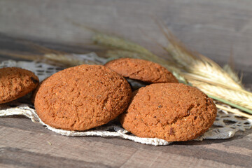 oat cookies and spikelets on sackcloth close up