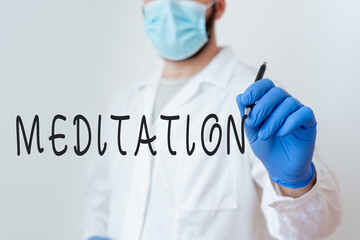 Conceptual hand writing showing Meditation. Concept meaning achieve a mentally clear and...