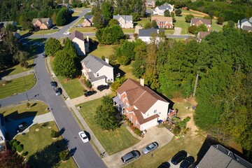 Fototapeta premium Beautiful aerial view of an upscale sub division in suburbs shot during the golden hour