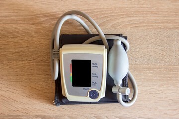 Tonometer stands on a wooden table in the office.