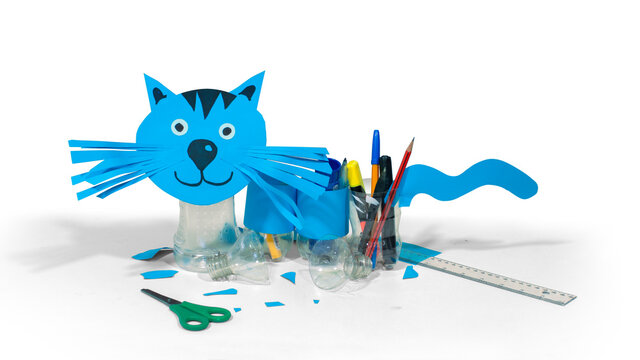 Blue Cat Made With Cardboard And Recycled Plastic Bottles That Can Be Used As Pencil Holders On White Background