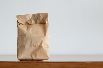 paper bag on wooden table background
