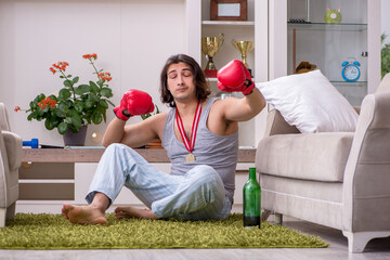 Male ex-champion boxer suffering from alcoholism at home
