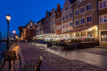 Buildings near the water at Motlawa river at dusk in Gdansk © ricjacynophoto.com