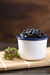 Fototapeta na wymiar Close up of organic black beans in healthy food concept 
