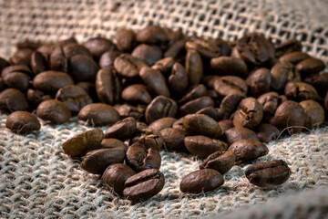 rosted grains brazilian coffee on jute background in Brazil