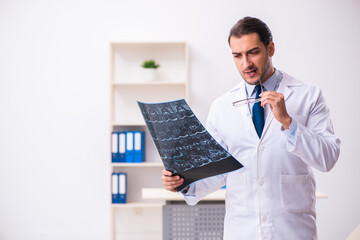 Young male doctor radiologist working in the clinic