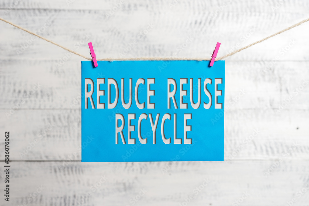 Poster handwriting text reduce reuse recycle. conceptual photo environmentallyresponsible consumer behavior