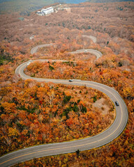 View of winding path to the mountain in Autumn shot by drone