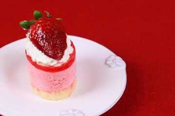 Close up Strawberry Cheese cake on red Background