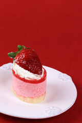 Close up Strawberry Cheese cake on red Background